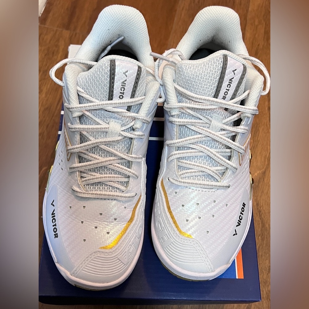 Victor White and Gold Athletic Shoes